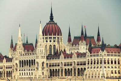 Low angle view of hungarian parliament building against sky in city