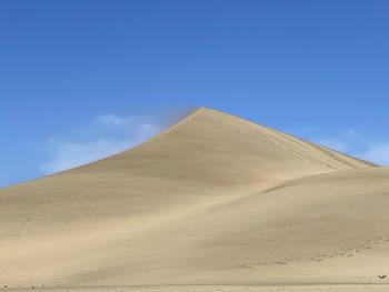 Scenic view of desert against sky