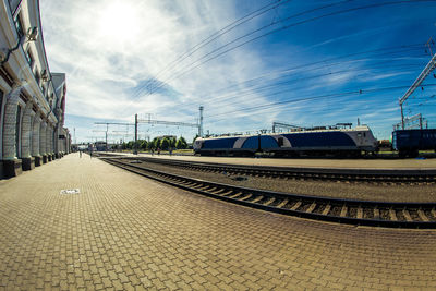 Train on railroad tracks against sky