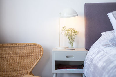 Empty chairs and table against wall at home