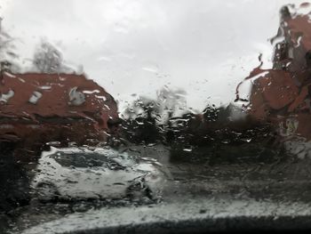 Close-up of wet glass window in rainy season