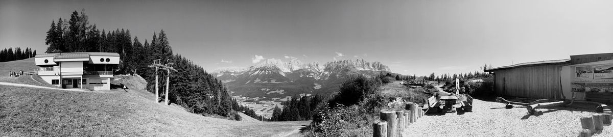 Panoramic view of trees and buildings against sky