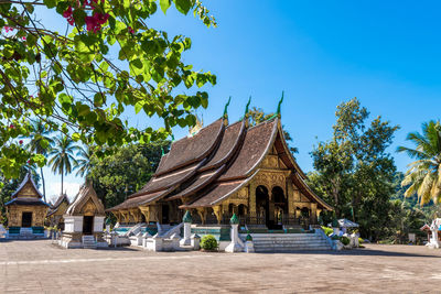 Low angle view of temple against clear blue sky