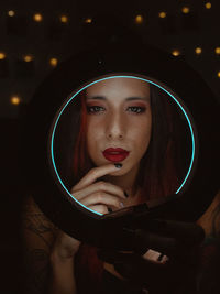 Portrait of young woman wearing hat