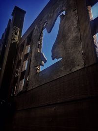 Low angle view of built structure against blue sky