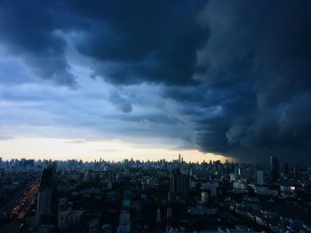 Cityscape against cloudy sky