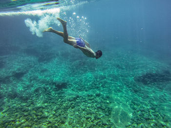 Person swimming in sea