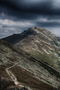 Idyllic shot of mountains against cloudy sky