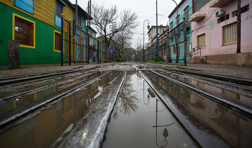 Surface level of wet railroad tracks in city during rainy season