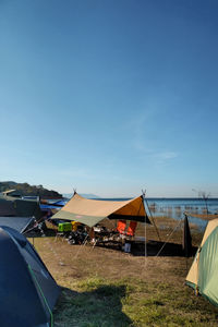 Scenic view of beach against blue sky