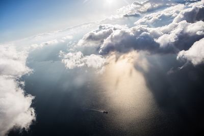 Scenic view of mountains against cloudy sky