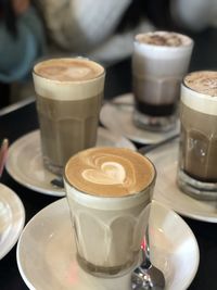 Close-up of cappuccino served on table