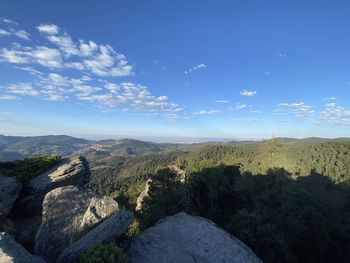 Scenic view of landscape against blue sky