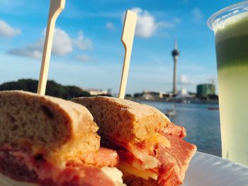 Close-up of food in sea against sky