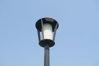 Low angle view of street light against sky