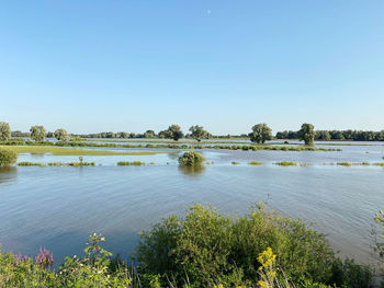 Scenic view of lake against clear sky