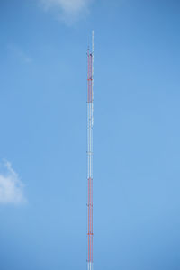 Low angle view of communications tower against sky