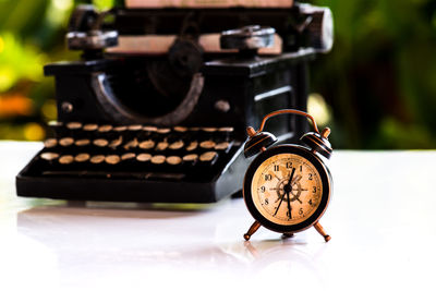 Close-up of clock on table