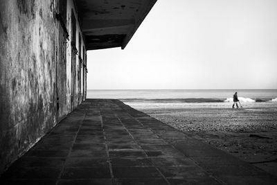 Built structure at beach against clear sky