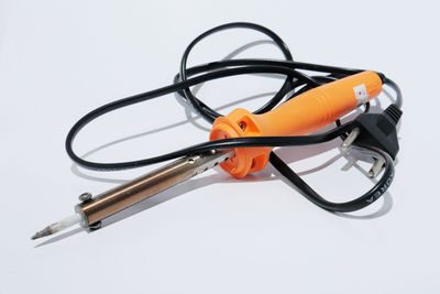 High angle view of electric lamp against white background