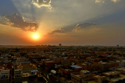 High angle view of townscape against sky during sunset