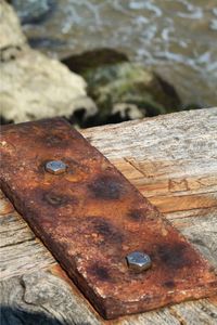 Close-up of rusty metal on rock