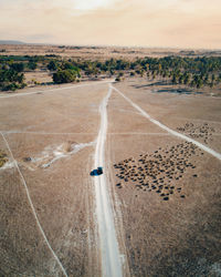 High angle view of road amidst land against sky