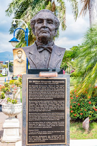 Statue in front of building