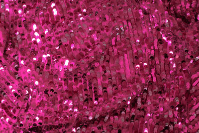 Shiny and glittering pink fabric with sequins. abstract background. events, celebrations, christmas