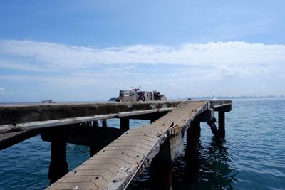 Pier over sea against sky