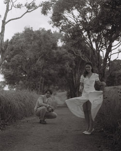 Rear view of girls and woman walking on land