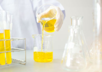 Close-up of yellow glass on table