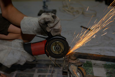 Low angle view of man working on fire