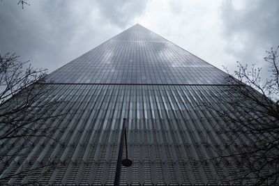 Low angle view of building against cloudy sky