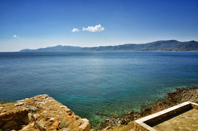 Scenic view of sea against blue sky