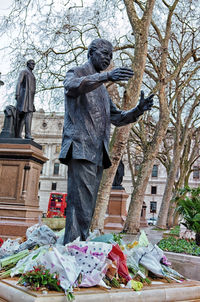 Low angle view of statue against trees