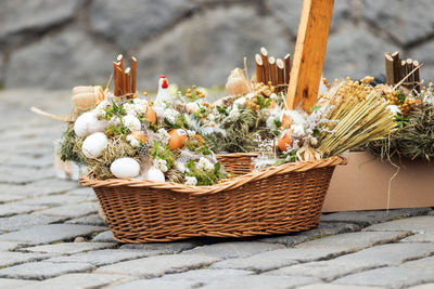 Close-up of easter basket decoration of a stall at street market in prague.