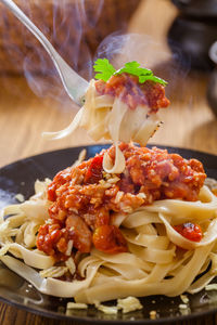 Close-up of pasta in plate on table