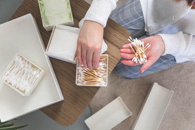 Midsection of woman using laptop