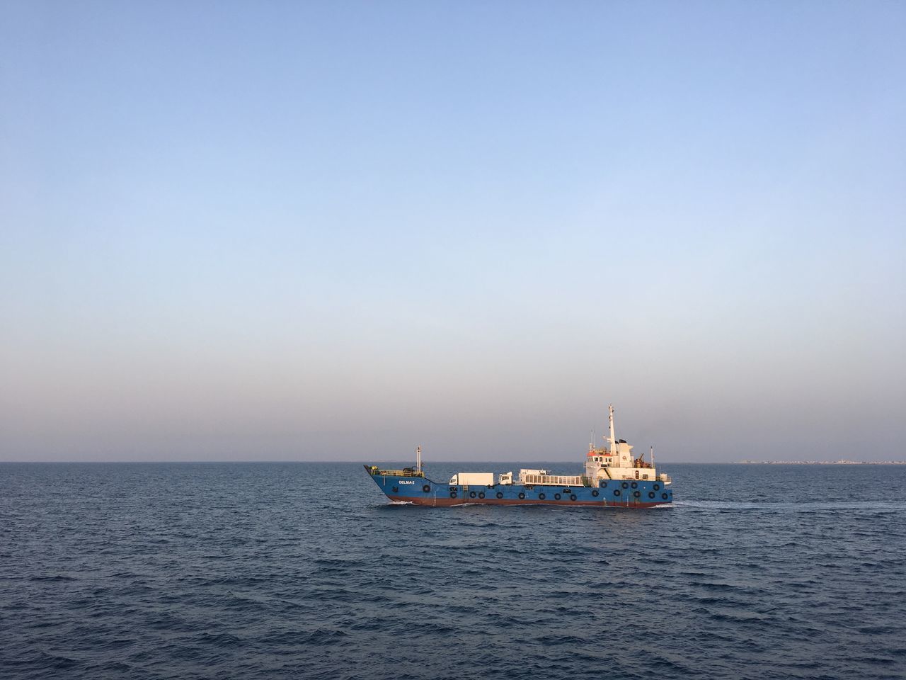 sea, water, nautical vessel, sky, transportation, mode of transportation, horizon over water, waterfront, copy space, horizon, clear sky, scenics - nature, ship, beauty in nature, nature, no people, oil industry, tranquil scene, day, outdoors, fishing boat