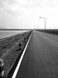 Empty road against sky