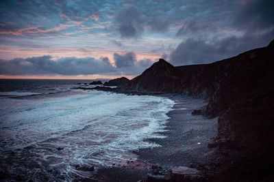 Sunset on english coastline in quay. 