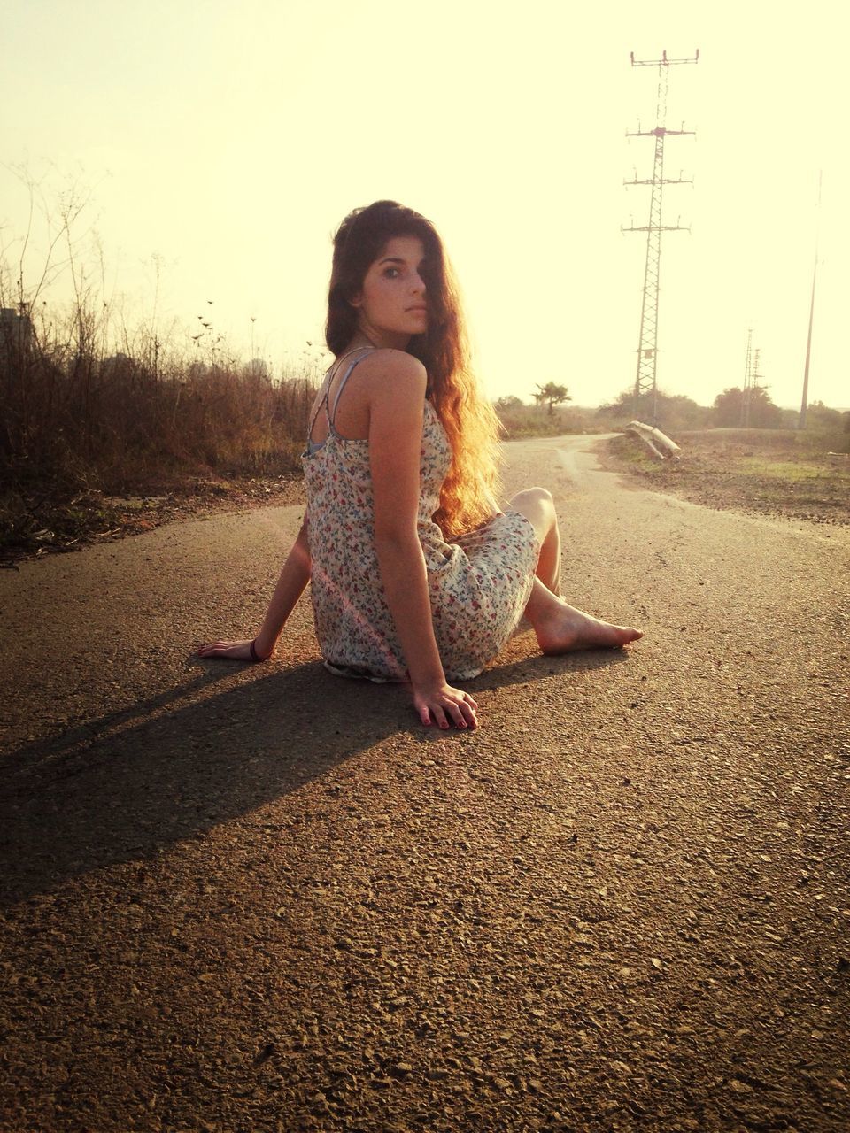 full length, young adult, person, lifestyles, casual clothing, leisure activity, portrait, looking at camera, young women, front view, side view, sunlight, sitting, standing, road, one animal, outdoors