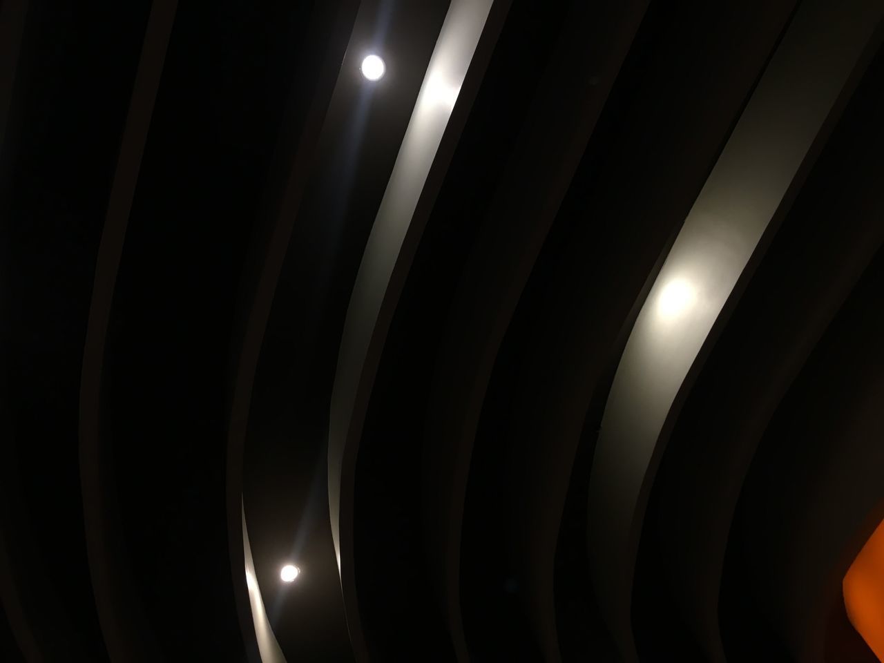 LOW ANGLE VIEW OF ILLUMINATED LIGHT BULB IN THE DARK