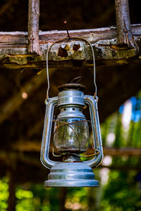 Low angle view of electric lamp hanging on ceiling