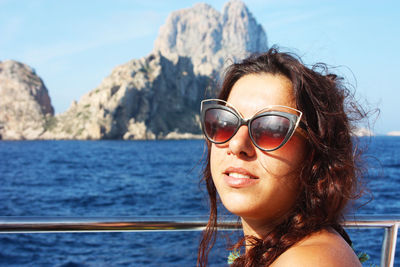 Portrait of smiling young woman in sea