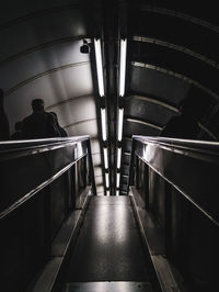 Man in illuminated corridor