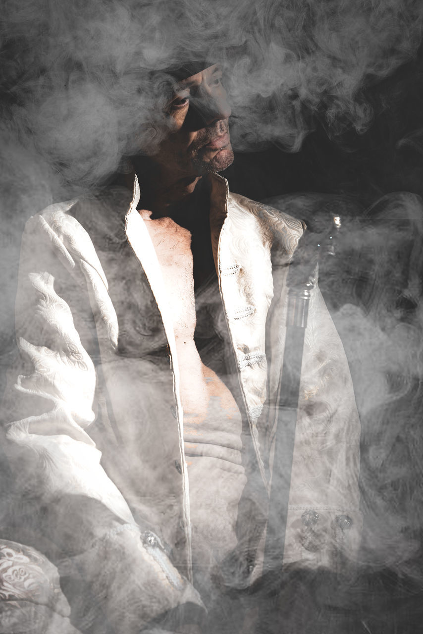 Smoke - Physical Structure One Person Indoors  Adult Studio Shot Digital Composite Full Length Front View Gray Nature Fantasy Creativity Motion Mystery Young Adult Black Background Human Body Part Shirtless Textured Effect