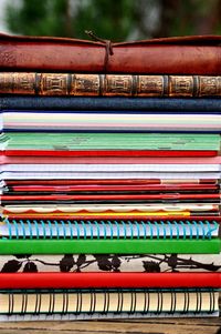 Piled notebooks on foreground