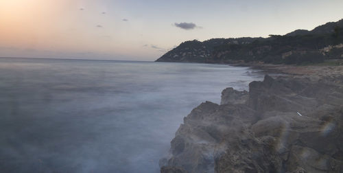 Scenic view of sea at sunset